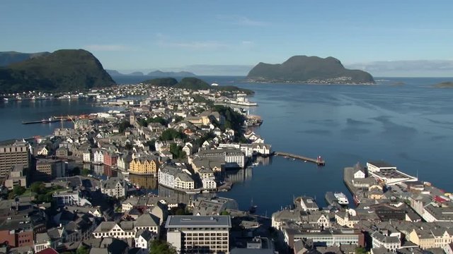 Elevated pan across Alesund, Norway from Aksla with cruise ship in port.