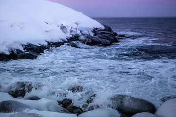 Snowy coast of Barents Sea in Teriberka, Murmansk Region, Russia