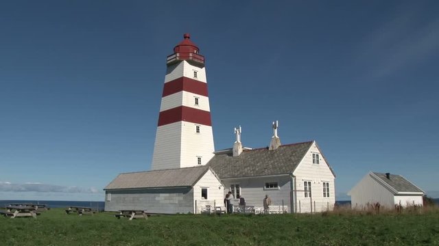 The Alnes lighthouse on the island of Godoy, Norway on a beautiful sunny day