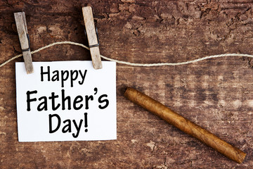 sign with the words Happy Fathers Day and a cigar