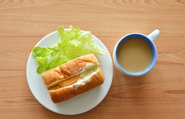 bread filled pork sausage dresing mayonnaise and coffee