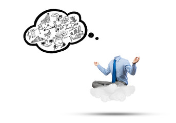 Headless businessman meditating