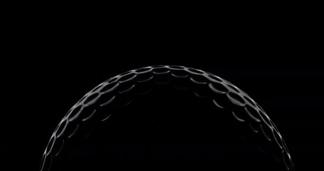 Golf ball slowly rotate on black background