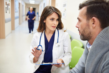 Doctor talking to her patient