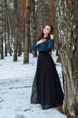 Fototapeta premium girl in the winter forest