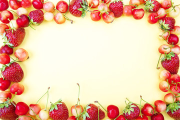 Frame made from fruits on a yellow background