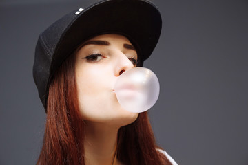 Girl inflates bubble gum