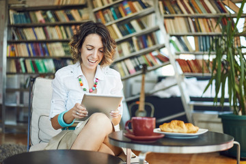 Woman surfing on a tablet