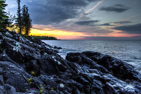 Northern Michigan Lake Superior Sunset. Rocky coast and cliffs on the shores of Lake Superior at sunset in Michigan's Upper Peninsula in Copper Harbor.