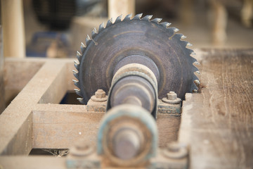 Carpenter cutting flaxboard using sliding compound mitre saw