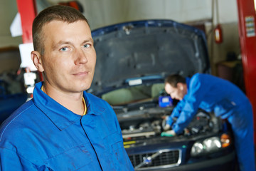 smiling repairman auto mechanic
