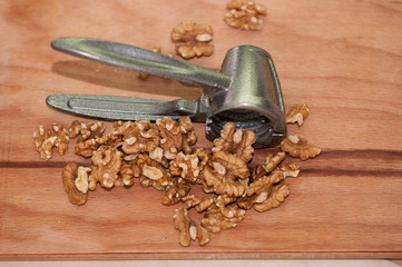 tongs for chopping walnuts and shelled walnut