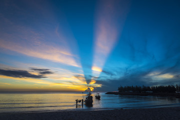 morning sea life with boat and fisherman, in sunrise