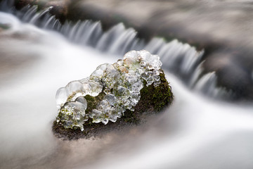 Frozen river in forest. Photoshooting with ND filter in Cutkovska valley, Slovakia