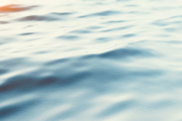 Blue water background with ripples, sea, ocean wave low angle view. Close-up Nature background. Soft focus with selective focus. 3d rendering