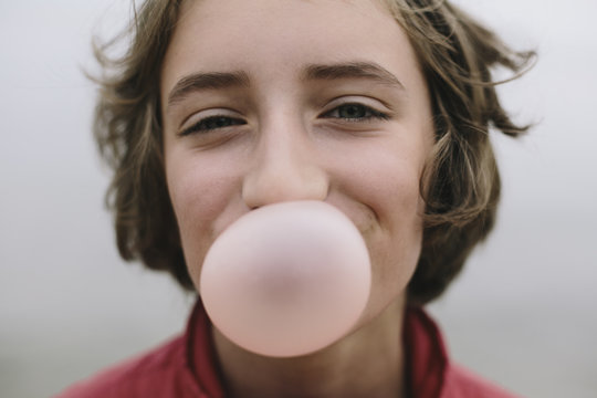 Girl blowing bubble gum