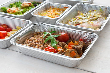 Healthy food take away, top view at wood background