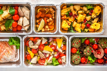 Healthy food take away, top view at wood background