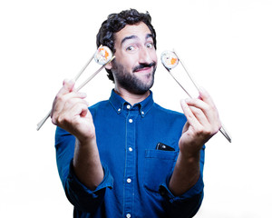 young man eating sushi. all right concept