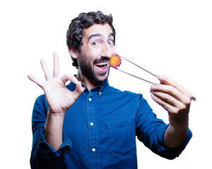 young man eating sushi. all right concept