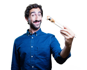 young man eating sushi. all right concept