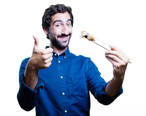 young man eating sushi. all right concept