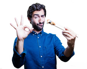 young man eating sushi. all right concept