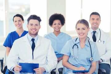 group of happy doctors on seminar at hospital