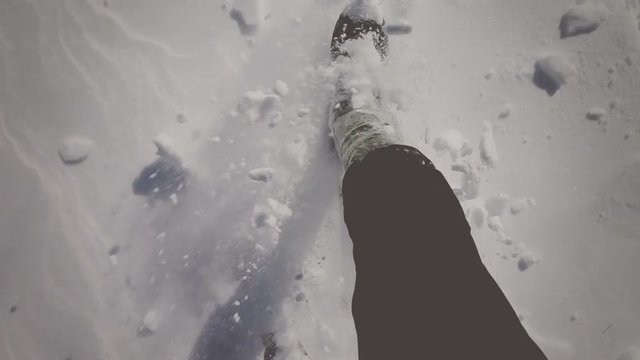 Walking through the snow on mountains. Vignette color correction