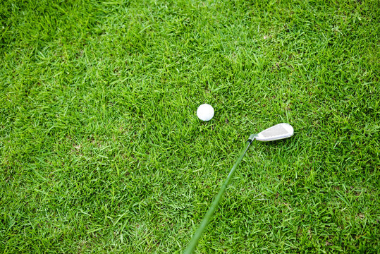Closeup on golfer golf ball on natural green grass background