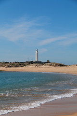 Seascape with the Trafalgar lighthouse in the background, on the shores of southern Spain