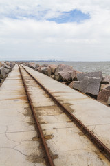 rail over breakwater at Cassino beach
