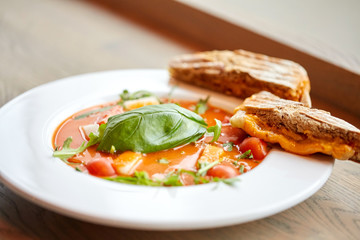 close up of gazpacho soup with bread at restaurant