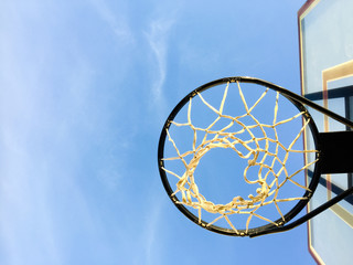 Basketball basket net on blue sky outdoors background