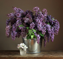 Bouquet of lilac in a bucket.
