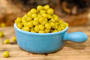 Steamed and chilled green peas ready to eat. Sweet and fresh to the taste. Here in a blue small enameled cast iron pot.