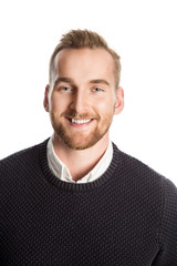 Handsome blonde mature man, standing against a white background wearing a dark sweater, white shirt...