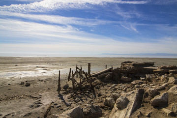 Desert beach dock after drought at Salton Sea in California desert