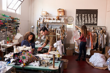 Team at work at a clothes manufacturing workshop