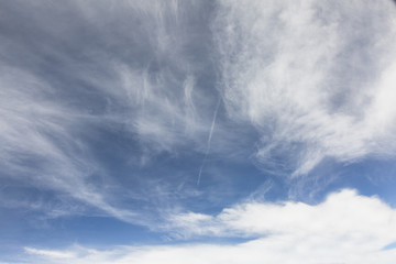 Fototapeta premium the sky when i am looking through window aircraft during flight in wing with a blue sky.