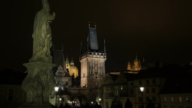 The Lesser Town tower in Czechia city of Prague 3840X2160 UHD tilting footage - Gothic archtecture of Charles bridge over Vltava river in Czech Republic capital slow tilt 2160p UltraHD video