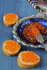 Red caviar toasts and caviar shell plate