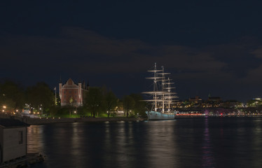 Fototapeta na wymiar View of the Skeppsholmen and Sodermalm at night time in Stockholm, Sweden.