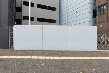  Large blank billboard on a street wall,  banners with room to add your own text