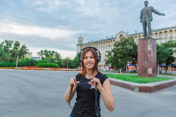 Fototapeta premium Asian girl listening to music with headphones