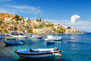 Fototapeta na wymiar Fishing boats at harbour of Symi. Dodecanese, Greece, Europe