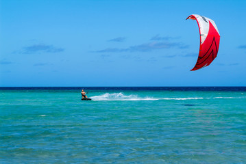 Man practicing kitesurf on Mayotte island, France