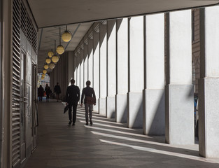 People walking on the walkway tunnel. 