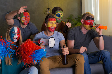 Happy friends with colored faces