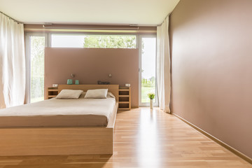 Fototapeta na wymiar Double bed in minimalist bedroom